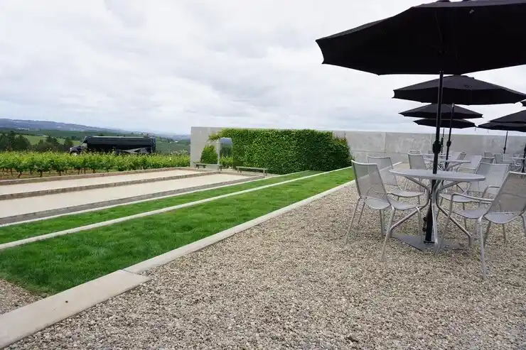 Stone patio with seating and lighting